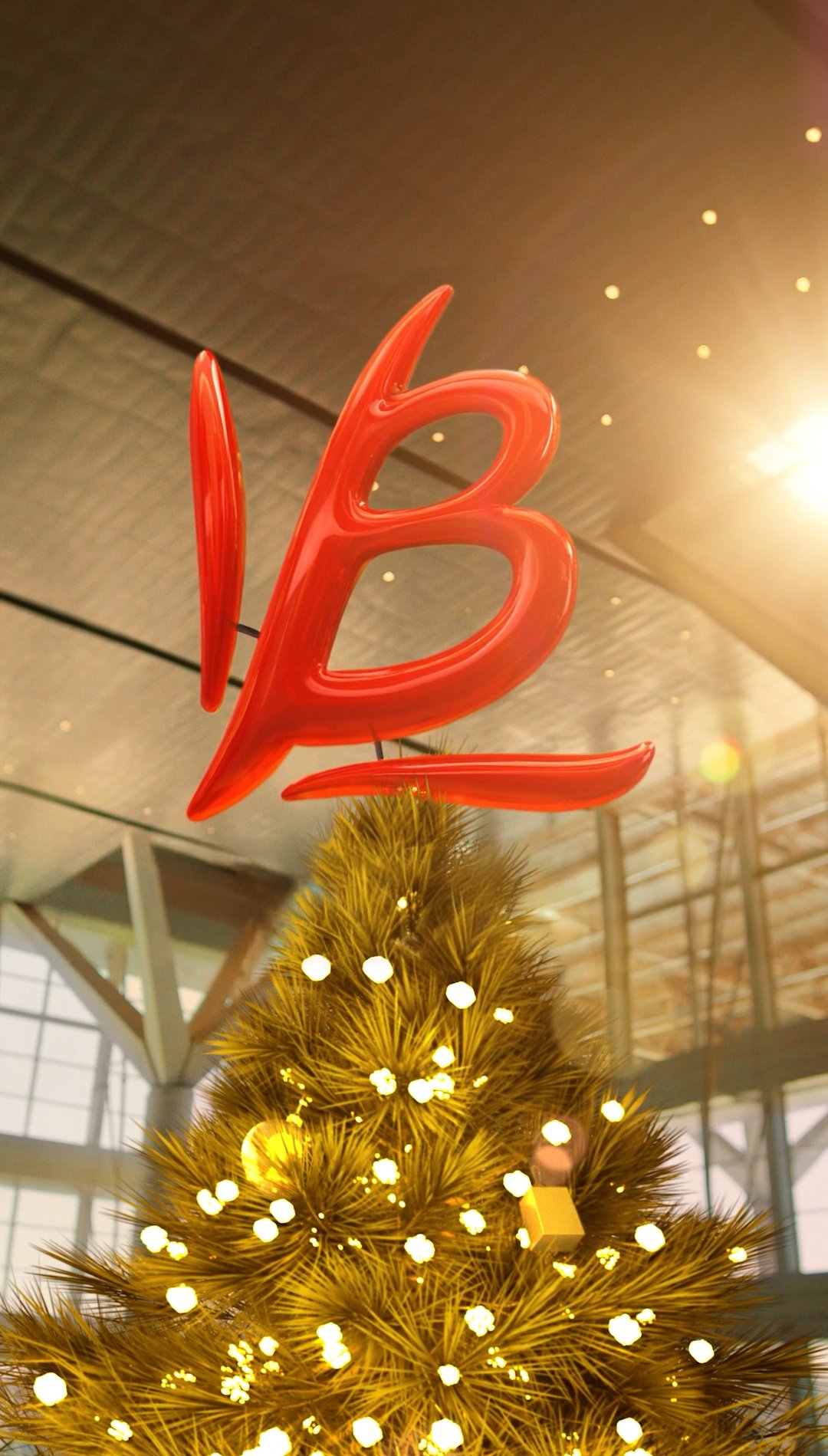 Bauducco B atop airport Christmas tree